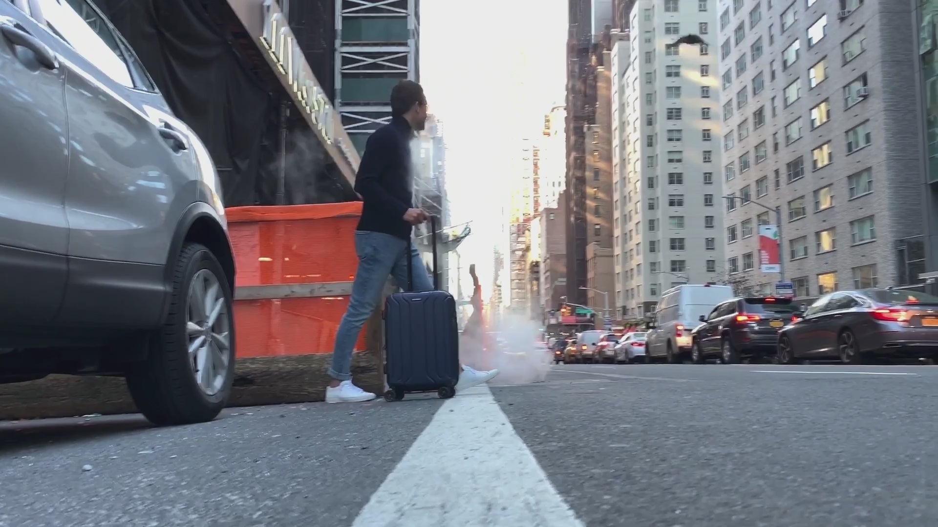 Load video: man walking in new york city with nonstop luggage